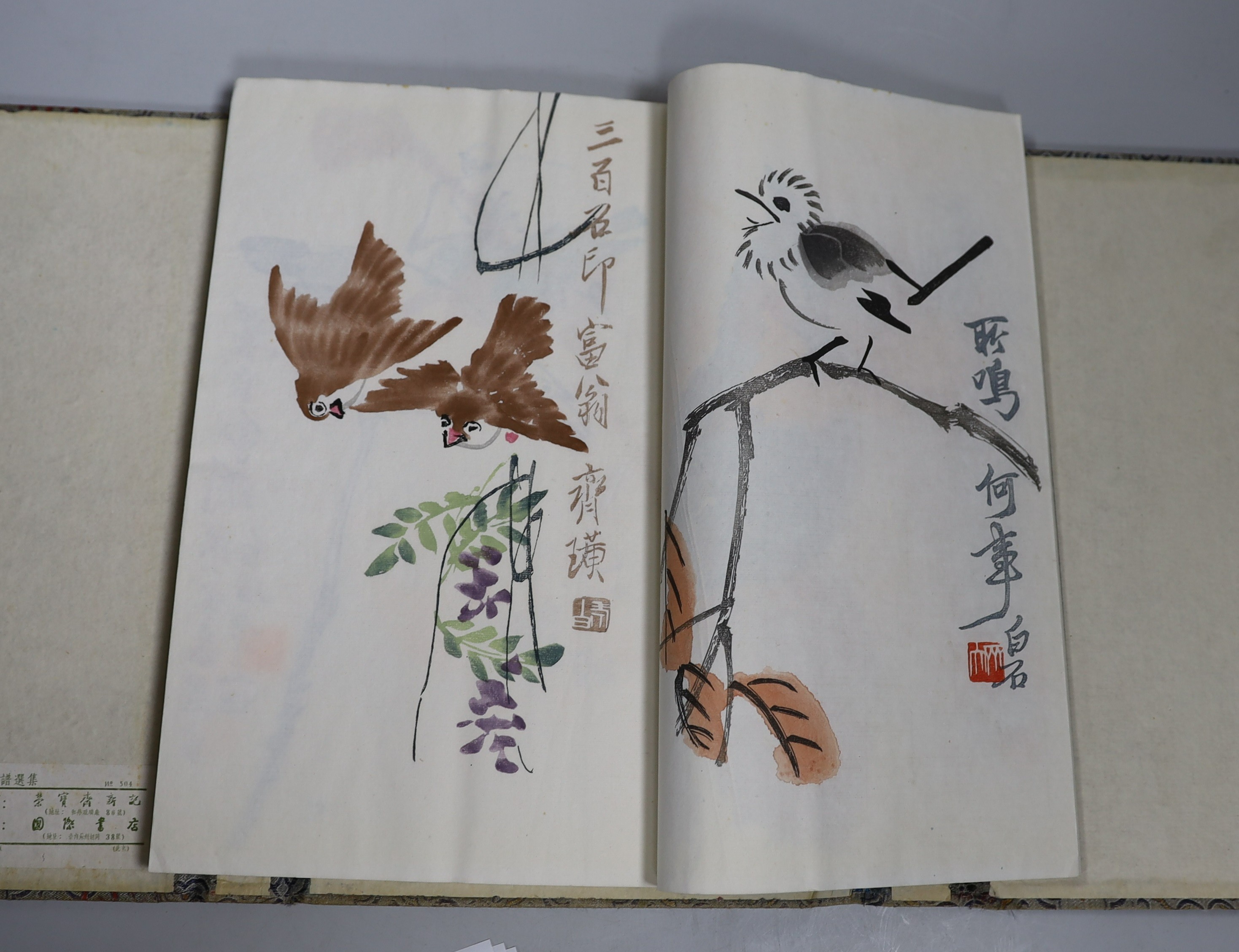 A Chinese book of woodblock prints of works by famous artists including Qi Baishi, published by Rongbao Ji, Beijing 1952